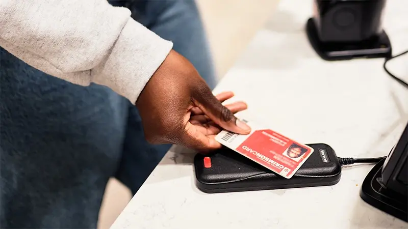 Card reader scanning a Crimson Card