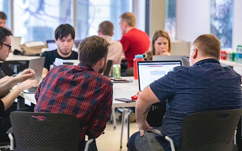 A group of people at computers